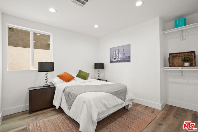 bedroom featuring hardwood / wood-style floors