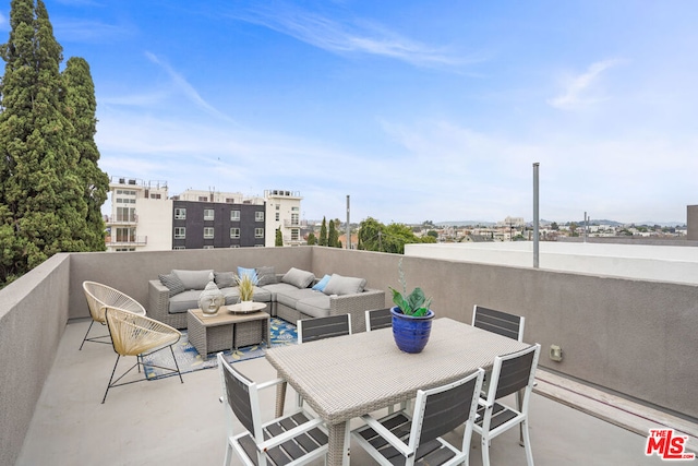 view of patio / terrace featuring an outdoor living space and a balcony