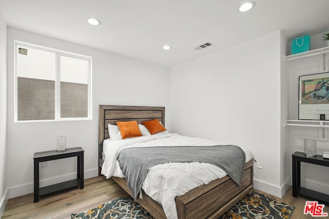 bedroom featuring hardwood / wood-style floors