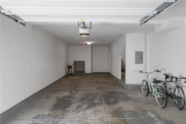 garage featuring a garage door opener and electric panel