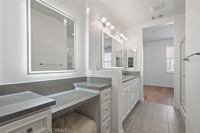 bathroom with vanity and tile patterned floors