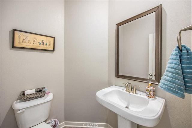 bathroom with sink and toilet