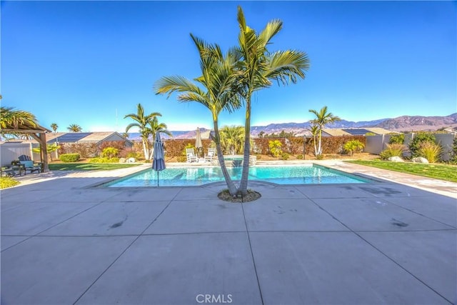 view of pool with a mountain view