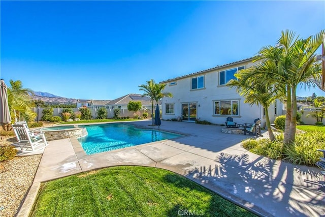 view of pool with an in ground hot tub and a patio area