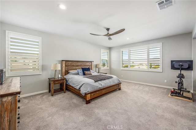 bedroom featuring ceiling fan and light carpet