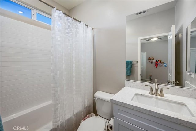 full bathroom featuring vanity, toilet, and shower / bathtub combination with curtain