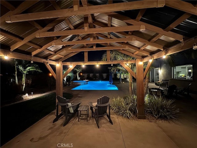 view of swimming pool featuring a gazebo and a patio area