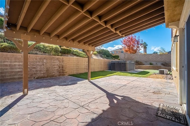 view of patio featuring a hot tub and central AC unit