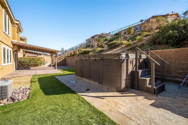 view of yard featuring a patio and central air condition unit