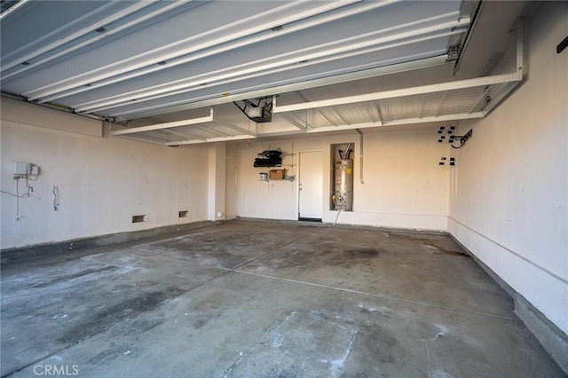 garage with a garage door opener and water heater