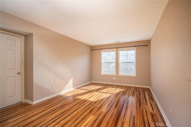 unfurnished room featuring light hardwood / wood-style floors