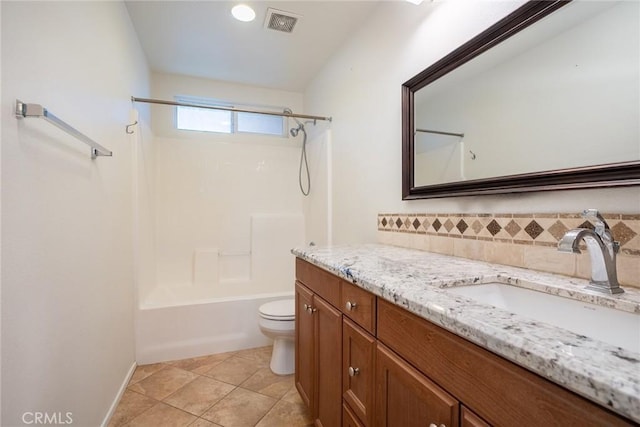 full bathroom featuring tile patterned flooring, shower / washtub combination, vanity, and toilet