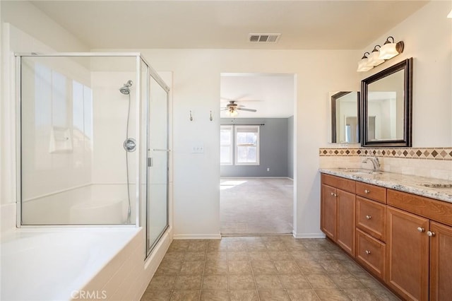 bathroom with walk in shower, decorative backsplash, vanity, and ceiling fan