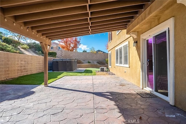 view of patio / terrace featuring a hot tub and cooling unit