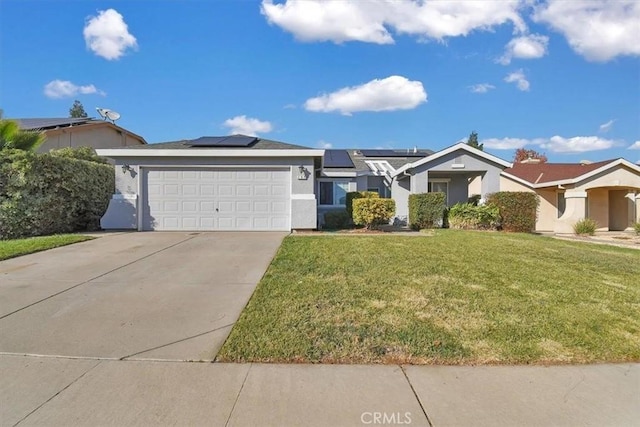 single story home featuring a front lawn, a garage, and solar panels