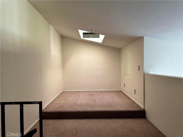 bonus room featuring carpet and vaulted ceiling