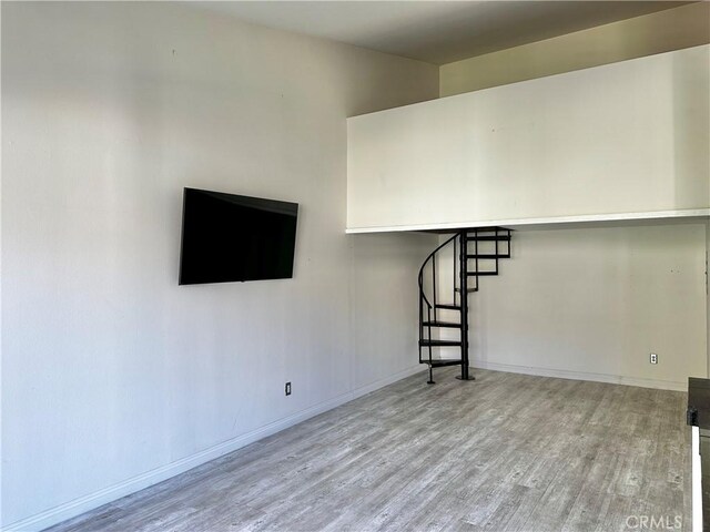 unfurnished living room featuring light wood-type flooring