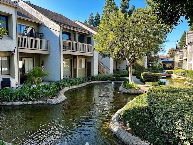 surrounding community featuring a water view