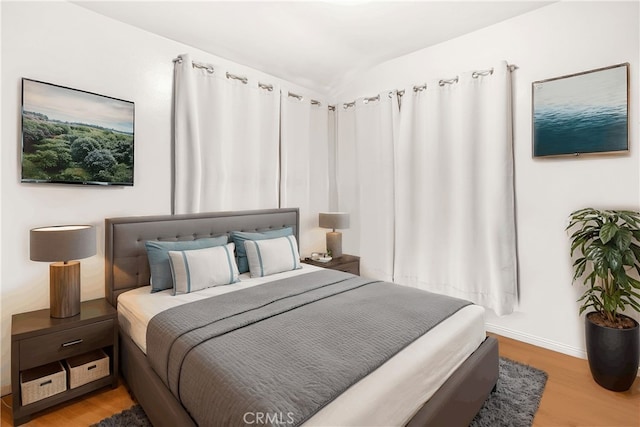 bedroom with hardwood / wood-style floors