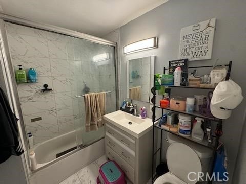 full bathroom featuring vanity, toilet, and combined bath / shower with glass door