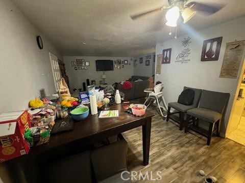 dining room with ceiling fan and hardwood / wood-style floors