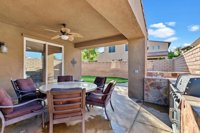 view of patio / terrace featuring area for grilling and ceiling fan