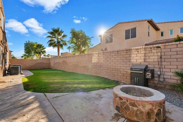 view of patio / terrace featuring a grill, an outdoor fire pit, and central air condition unit