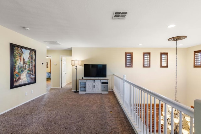 unfurnished living room with carpet flooring