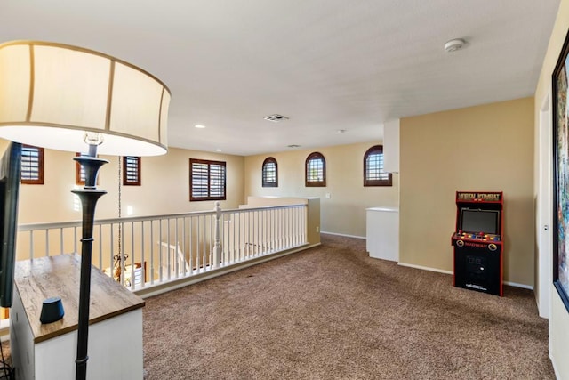 carpeted empty room featuring plenty of natural light