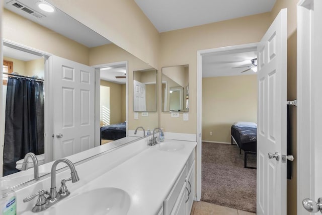 bathroom with tile patterned flooring and vanity