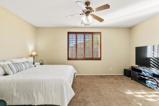 bedroom with light carpet and ceiling fan