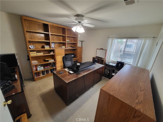 carpeted home office with ceiling fan