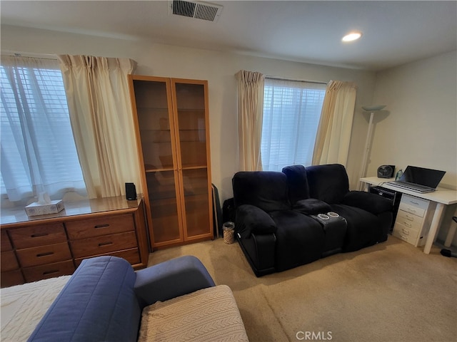 living room with light carpet and a wealth of natural light