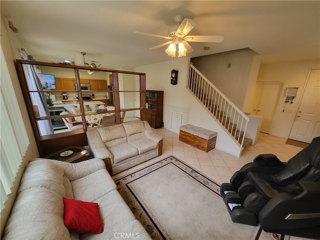 tiled living room featuring ceiling fan