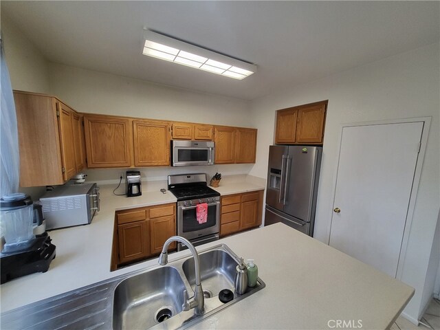 kitchen featuring sink and appliances with stainless steel finishes