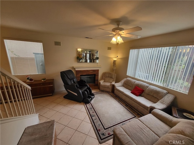 tiled living room featuring ceiling fan