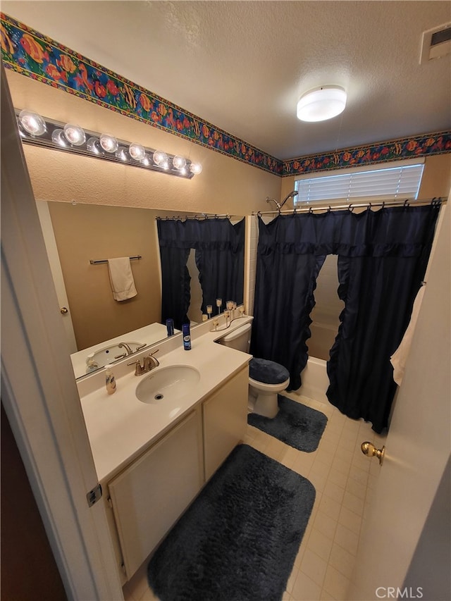 bathroom featuring walk in shower, vanity, a textured ceiling, and toilet