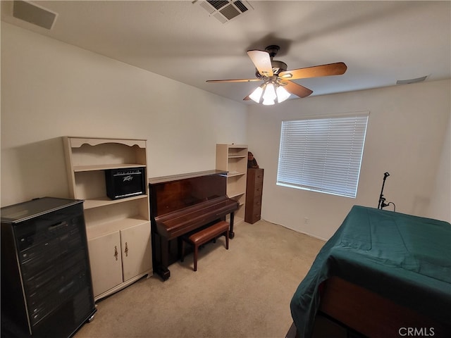 bedroom with light colored carpet and ceiling fan