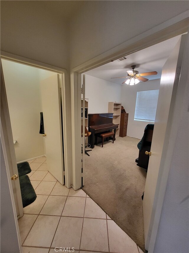 corridor with light colored carpet