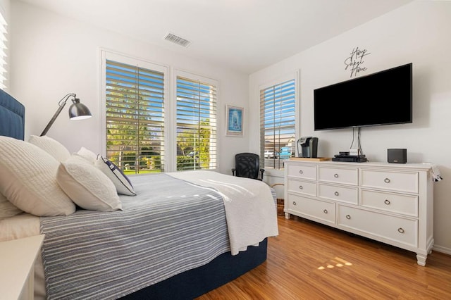 bedroom with light hardwood / wood-style flooring