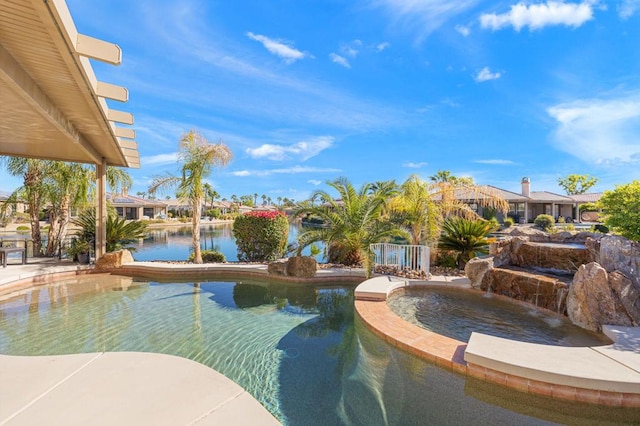 view of swimming pool featuring a water view