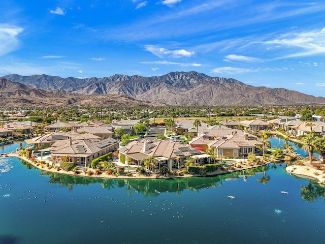 bird's eye view with a water and mountain view