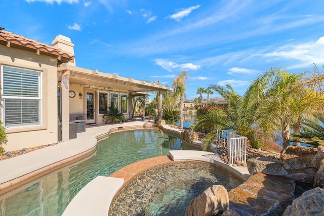 view of swimming pool with a patio