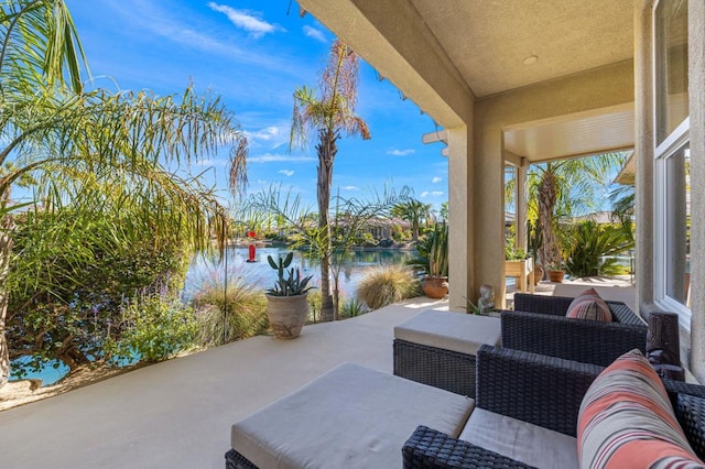 view of patio / terrace featuring outdoor lounge area and a water view