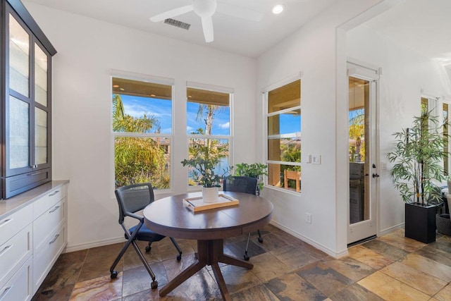 dining space with ceiling fan