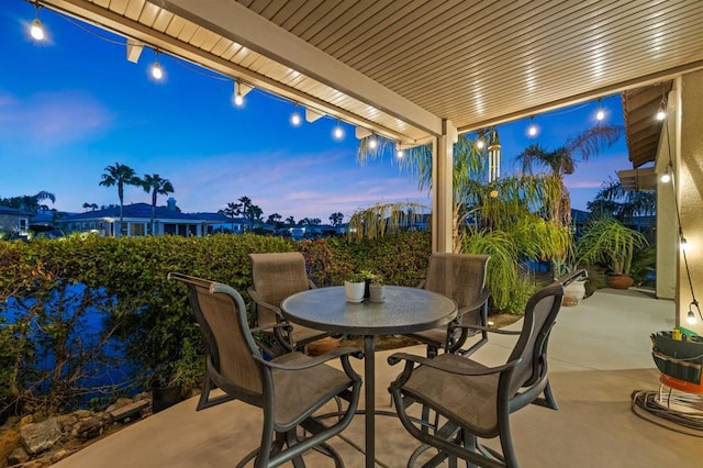 view of patio terrace at dusk