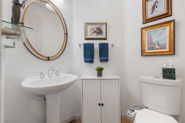 bathroom with toilet and sink