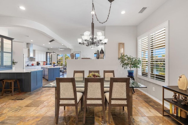 dining area featuring a notable chandelier