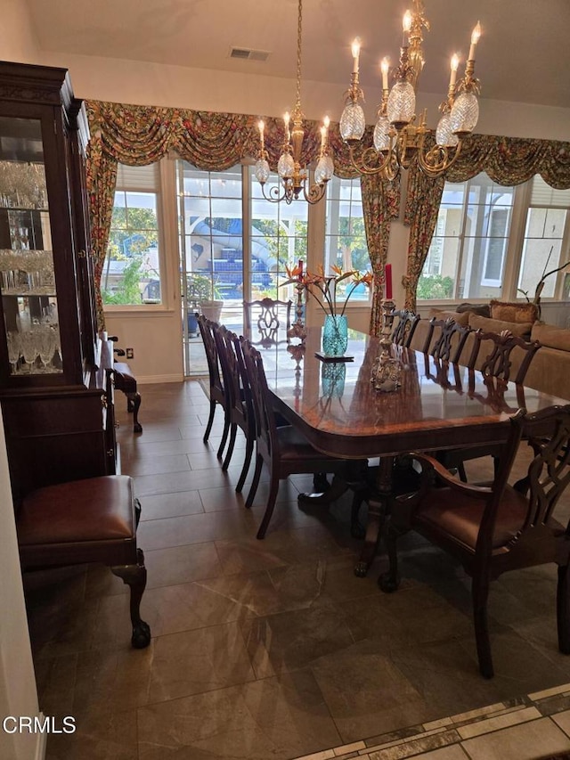 dining room featuring a chandelier