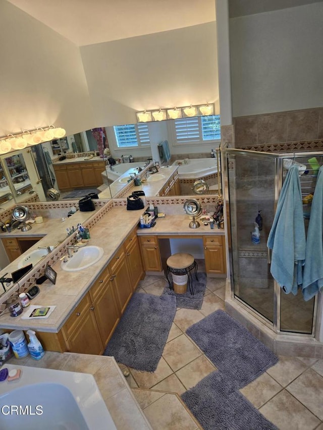 bathroom featuring tile patterned flooring, vanity, and independent shower and bath